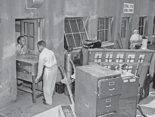 Raymond Carlson (left) helps move furniture from our first office.