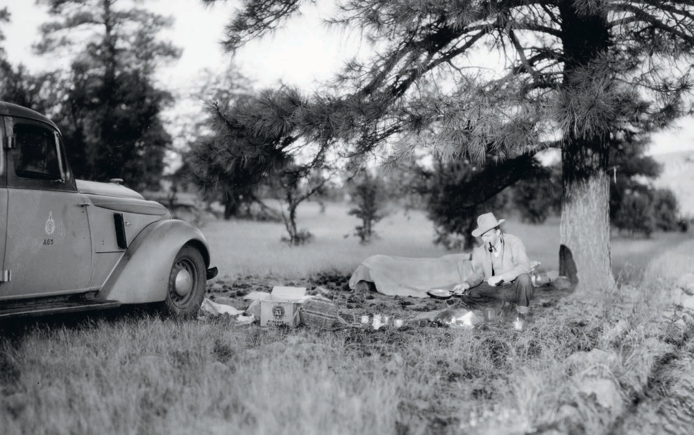 Norman G. Wallace sets up camp near his Arizona Highway Department vehicle in an undated photo. ARIZONA HISTORICAL SOCIETY