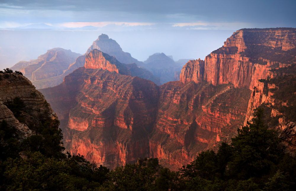 Summer rainfall creates a dreamy atmosphere at sunrise in the Grand Canyon. This view is from the North Rim, which sees only about 10 percent of Grand Canyon National Park's 6 million annual visitors.