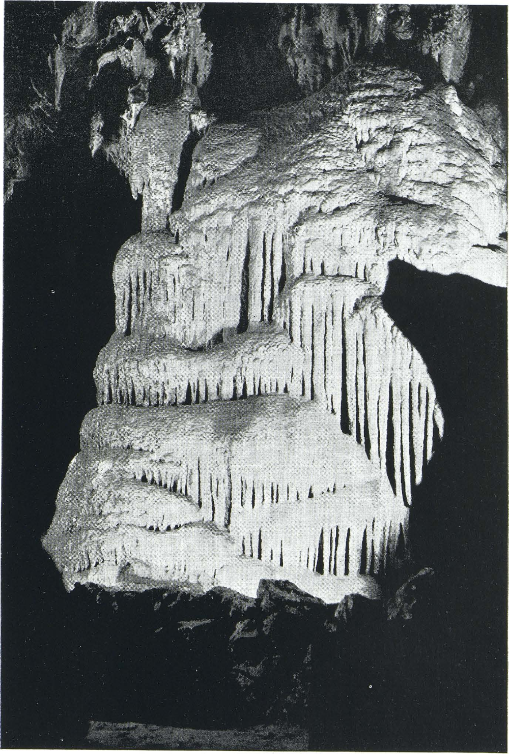 The frozen waterfall which is located deep in Colossal Cave. Now a "dead cave," plans are being made to force water from the surface over the above formation. The action will be the same that created this subterannean wonder.