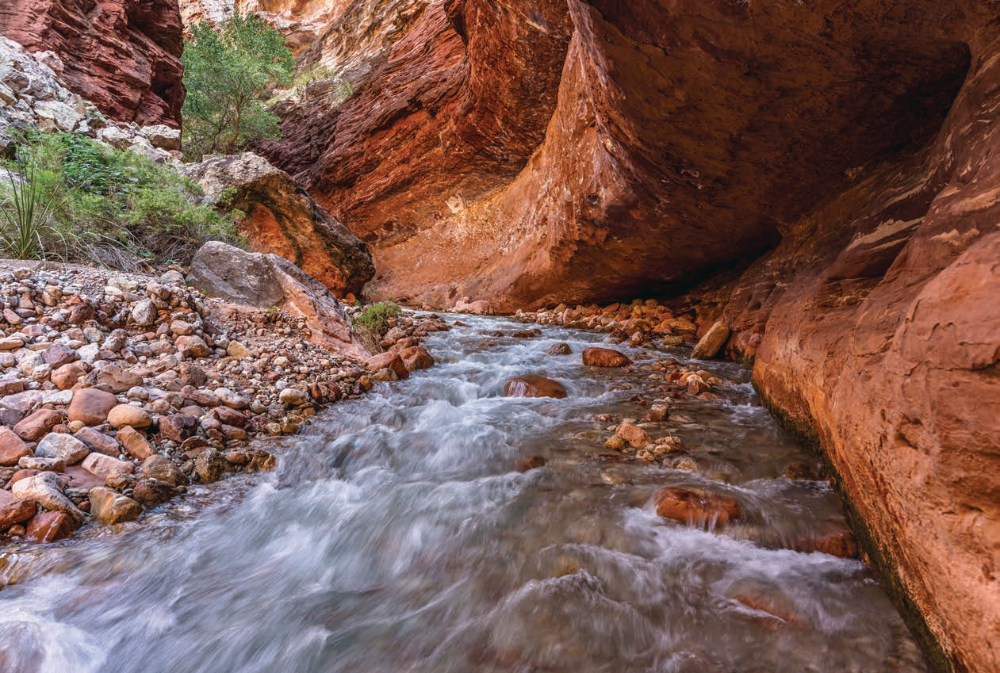 Water flows through a rock “tunnel” on Tapeats Creek, referred to in this story as the Thunder River. This spot is upstream from the confluence of the two waterways.