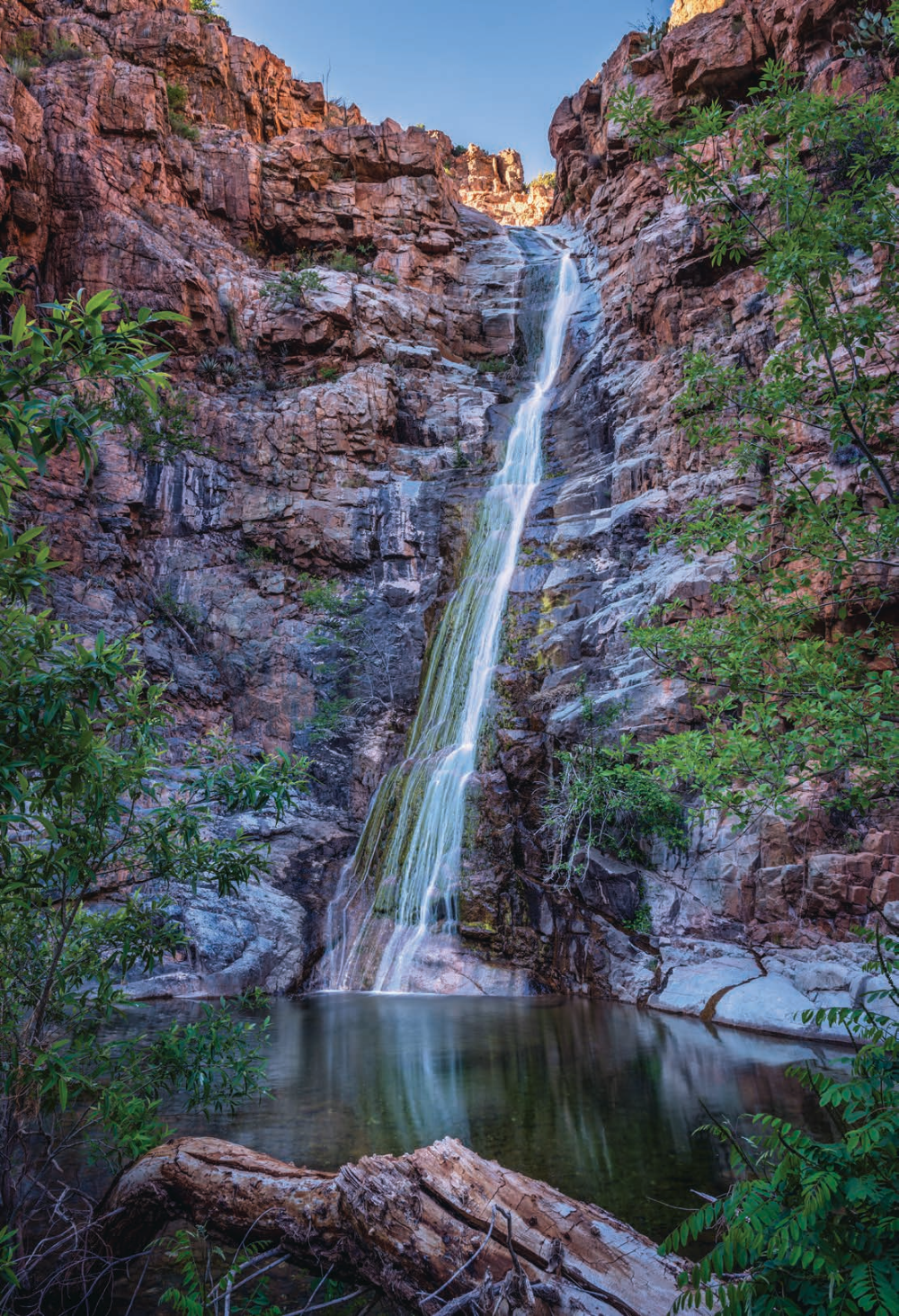 Spring snowmelt fuels an ephemeral waterfall in Gaddes Canyon, south of Jerome, in late-afternoon light. This canyon is on the east side of Mingus Mountain, one of the highest points in the Black Hills. | Theresa Rose Ditson | NIKON D810, 1/5 SEC, F/13, ISO 64, 24 MM LENS