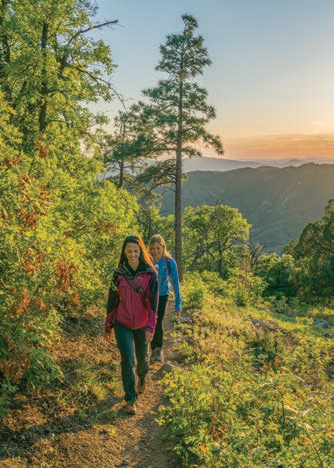 Jaymee Bohannon (foreground) and Mara Martin navigate this up-and-down hiking route.