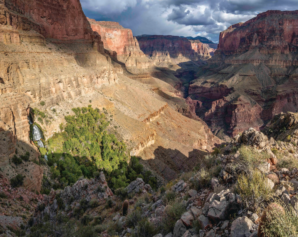 Thunder River Falls pours from an opening in a steep cliff in the Grand Canyon. From here, the Thunder River - referred to in this story as Thunder Creek - flows for only half a mile to its intersection with Tapeats Creek, making it one of the world's shortest rivers.