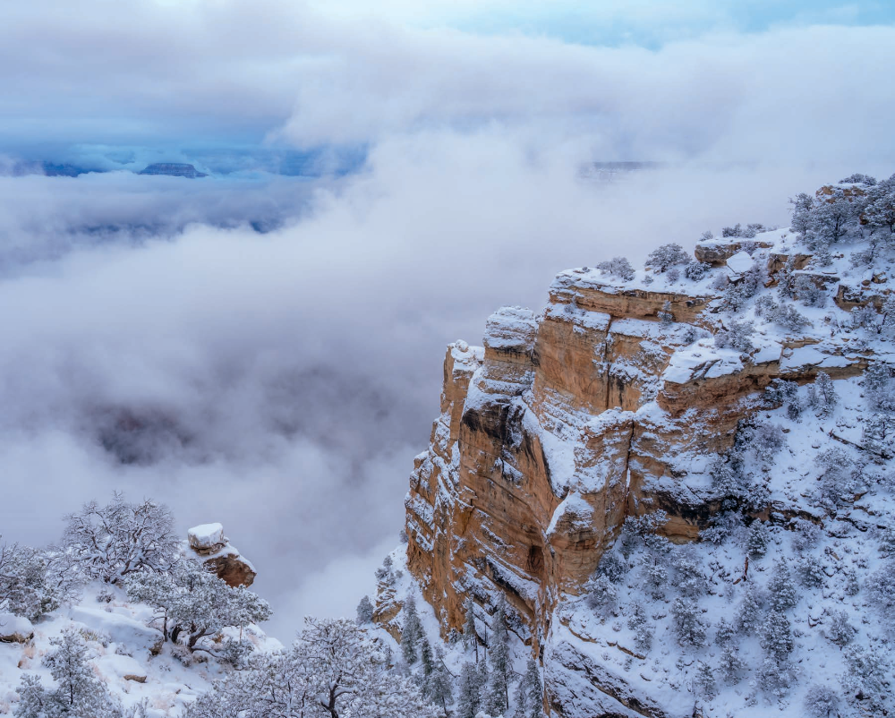 Clouds fill the Canyon during a winter storm, as seen from Maricopa Point, another South Rim overlook. The weather phenomenon seen here, known as an inversion, occurs when warm air above the Canyon traps cooler air below the rim. | Laurence Parent