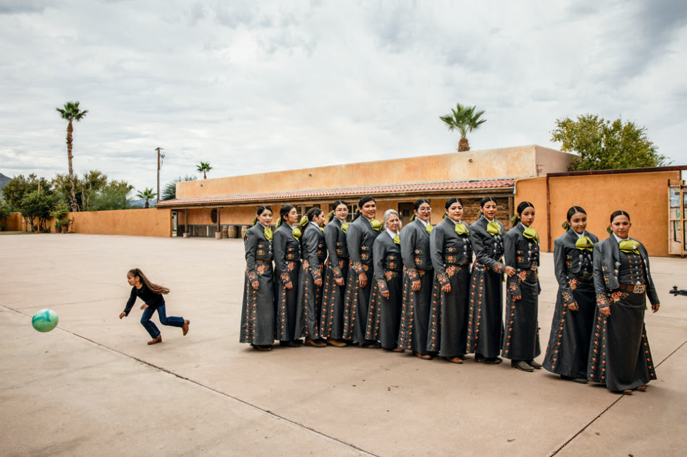 As a way to tie modern methods to a deeply traditional sport, members of Amazonas de Corazón line up to record a TikTok video before their Rancho Corona performance.