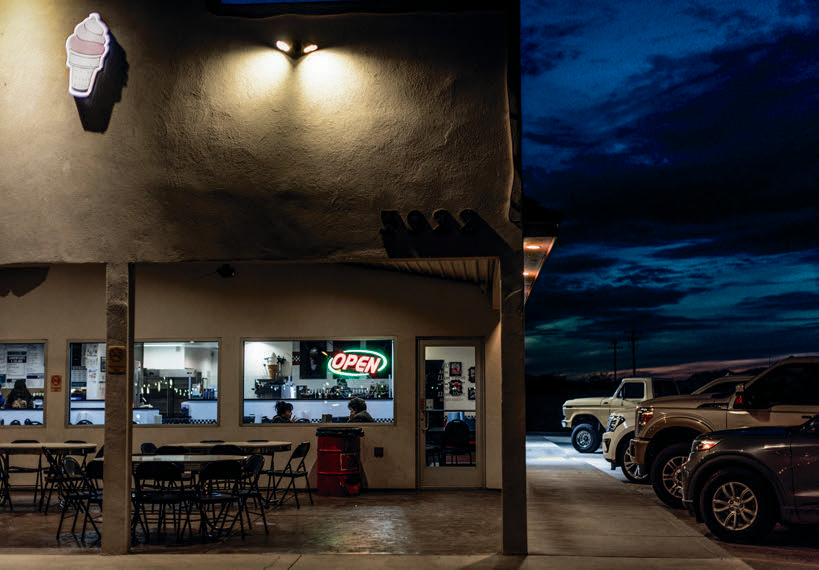 Joe’s Ride N Dine in Safford is illuminated against a dusky sky.
