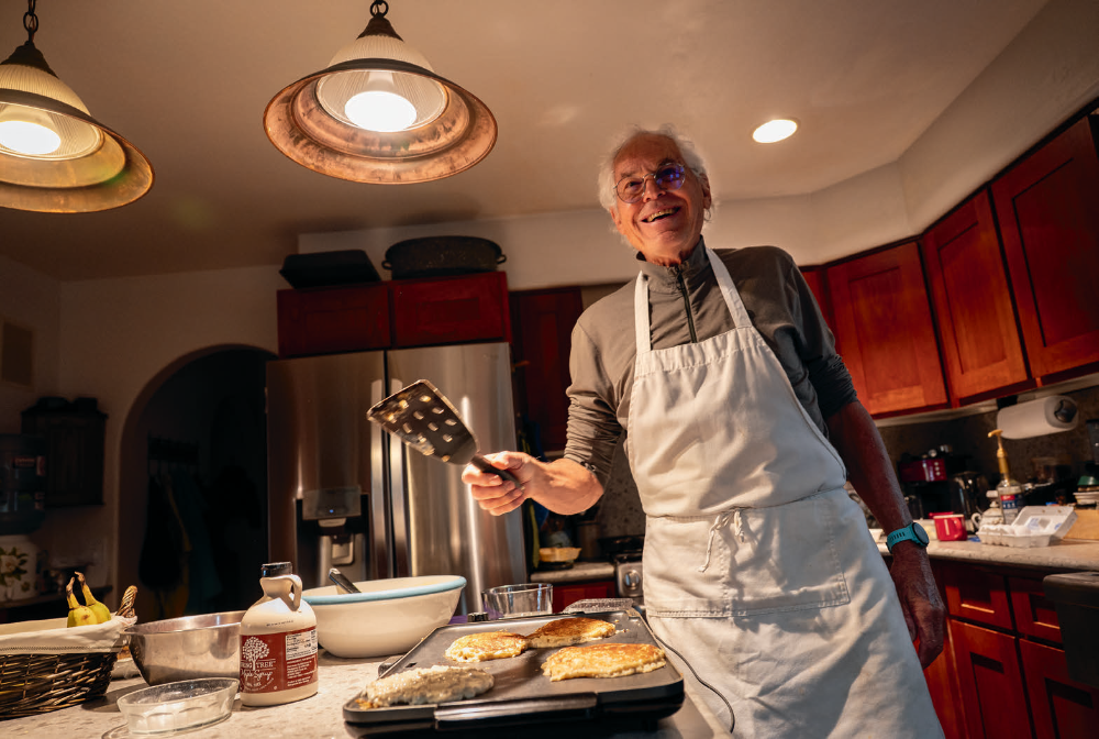 Tim Varner makes pancakes for Keil in his Flagstaff home. Although “angels” aren’t officially affiliated with the Arizona Trail Association, hikers can reach out via a database of volunteers’ phone numbers.