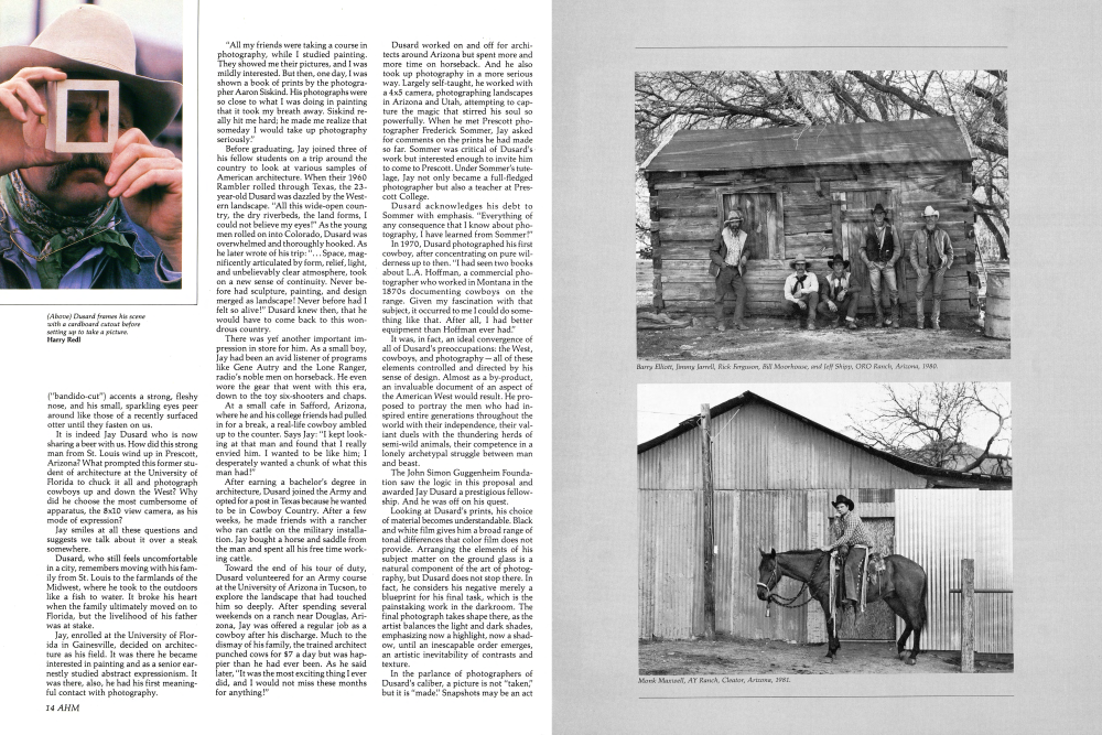 Dusard frames his scene with a cardboard cutout before setting up to take a picture.