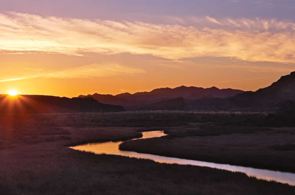 Sunrise comes quietly over the Bill Williams River near its western Arizona confluence with the Colorado River. The Bill Williams is named after a pioneering mountain man who traversed Arizona in the early 1800s.