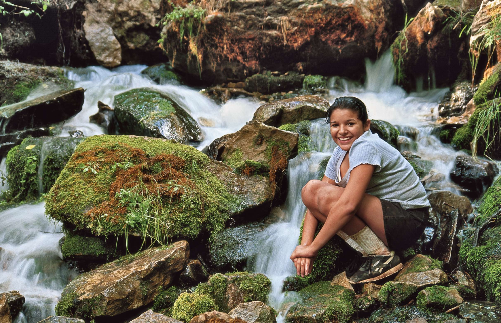 SPRING IN SUMMER Hiker Lisa Villa of Phoenix keeps her cool at Horton Springs on the Horton Creek Trail - a shady, verdant route with a burbling water soundtrack.