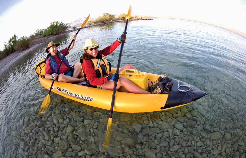 Julie Smith and Jay Holiday kayak in the clear water of Lake Mohave, one of four major reservoirs along the Colorado River.
