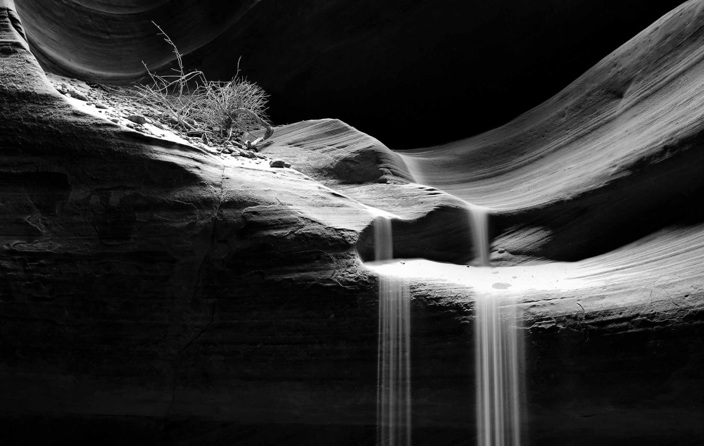 "Spotlit Sand Falls"