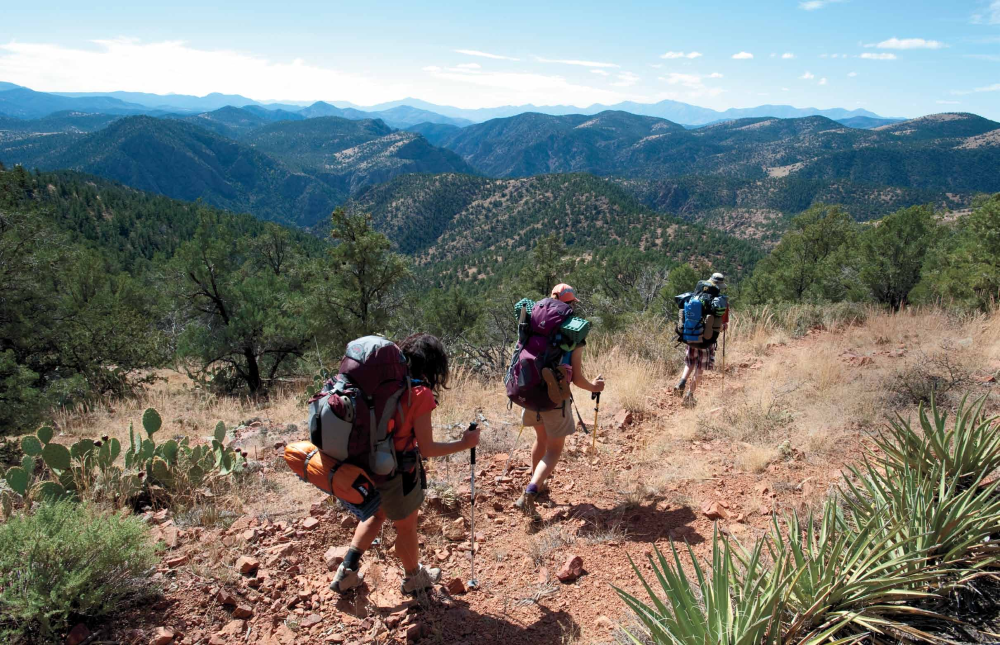 Karen Pugliesi, writer Annette McGivney and McGivney's son, Austin, hike out of the Hellsgate Wilderness along Hellsgate Trail 37.