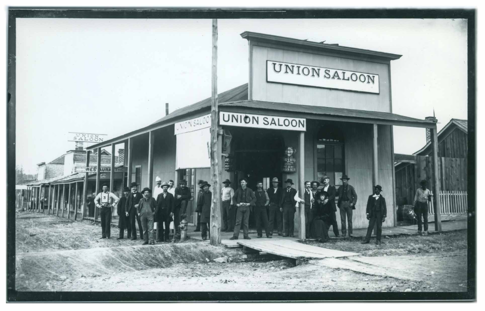 Prescott locals pose for a photo in front of Union Saloon, at the corner of Granite and Goodwin streets, in 1890. The Union was a favorite watering hole for gamblers.