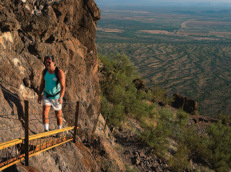 Cabled pathways offer some reassurance along the vertigo- inducing trail to the summit of Picacho Peak.