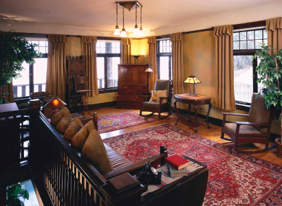 Period furnishings add authenticity to the warmth of the upstairs parlor. Throughout the Kolbs' private quarters, large windows offer panoramic views of Emery and Ellsworth's beloved Grand Canyon.