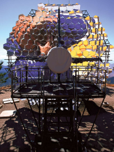 Photographer David H. Smith's reflection captured in the mirrors of the Fred Lawrence Whipple Observatory's optical reflector provides a graphic visual display of its light-collecting capabilities.