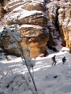 Along with his trusted snow hound, author Doug McGlothlin and Flagstaff outfitter Brady Black trudge through a pristine winter wonderland at the base of Pumphouse Wash in search of some cutting-edge adventure.