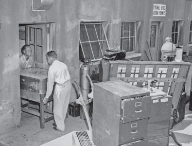 Raymond Carlson (left) helps move furniture from our first office.