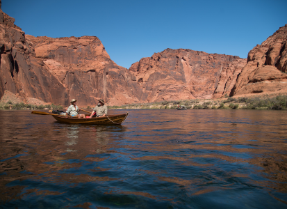 John Tveten (left) and writer Craig Childs take in the view of the Colorado River from a Swampscott dory in the stretch of Glen Canyon below Glen Canyon Dam.