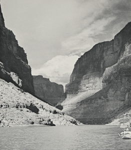 Norman Nevills' 1940 expedition, which included Barry Goldwater, navigates the Colorado River at the mouth of Kanab Creek in the Grand Canyon.