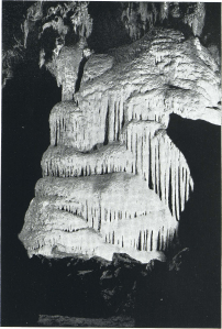 The frozen waterfall which is located deep in Colossal Cave. Now a "dead cave," plans are being made to force water from the surface over the above formation. The action will be the same that created this subterannean wonder.