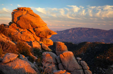 The setting sun lights a rock formation near Windy Point Vista along the Catalina Highway.