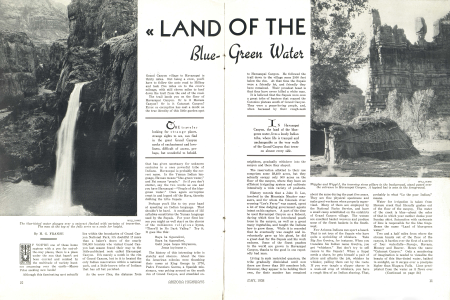 The blue-tinted water plunges over a cataract flanked with curtains of travertine. The men at the top of the falls serve as a scale for height.