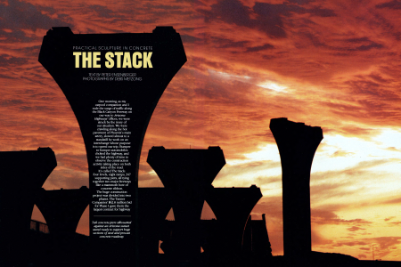 Tall concrete piers silhouetted against an Arizona sunset stand ready to support buge sections of steel and precast concrete roadway.